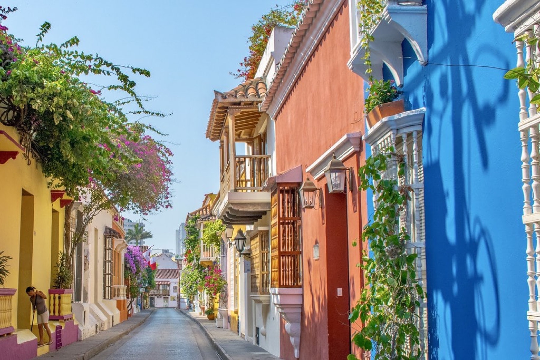 A colonial-era street in Cartagena, Colombia, with balconies in terracotta, ochre and blue